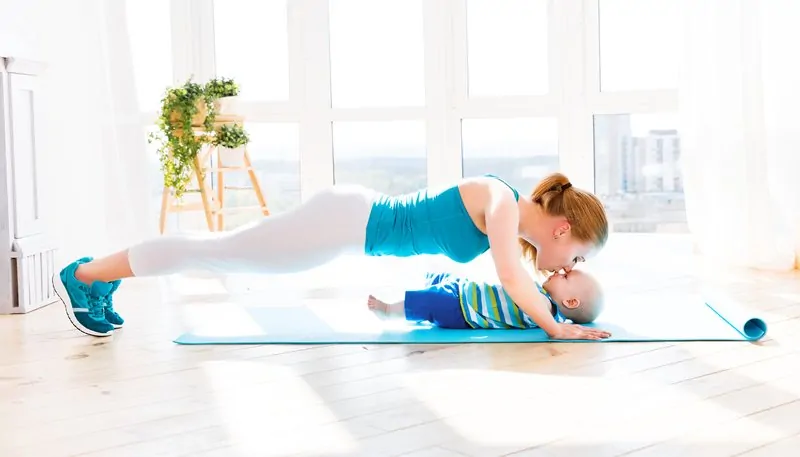 yoga mom interacting with baby