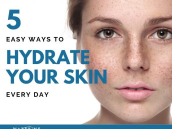Young woman's face with freckles promoting healthy skin.